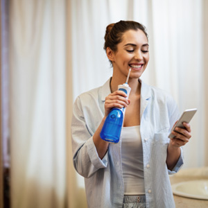 Falmouth patient brushing teeth at home