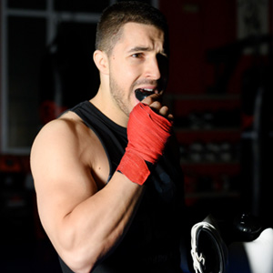 Falmouth adult holding custom mouthguard