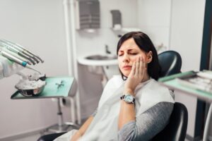 Woman at her dentist with tooth pain